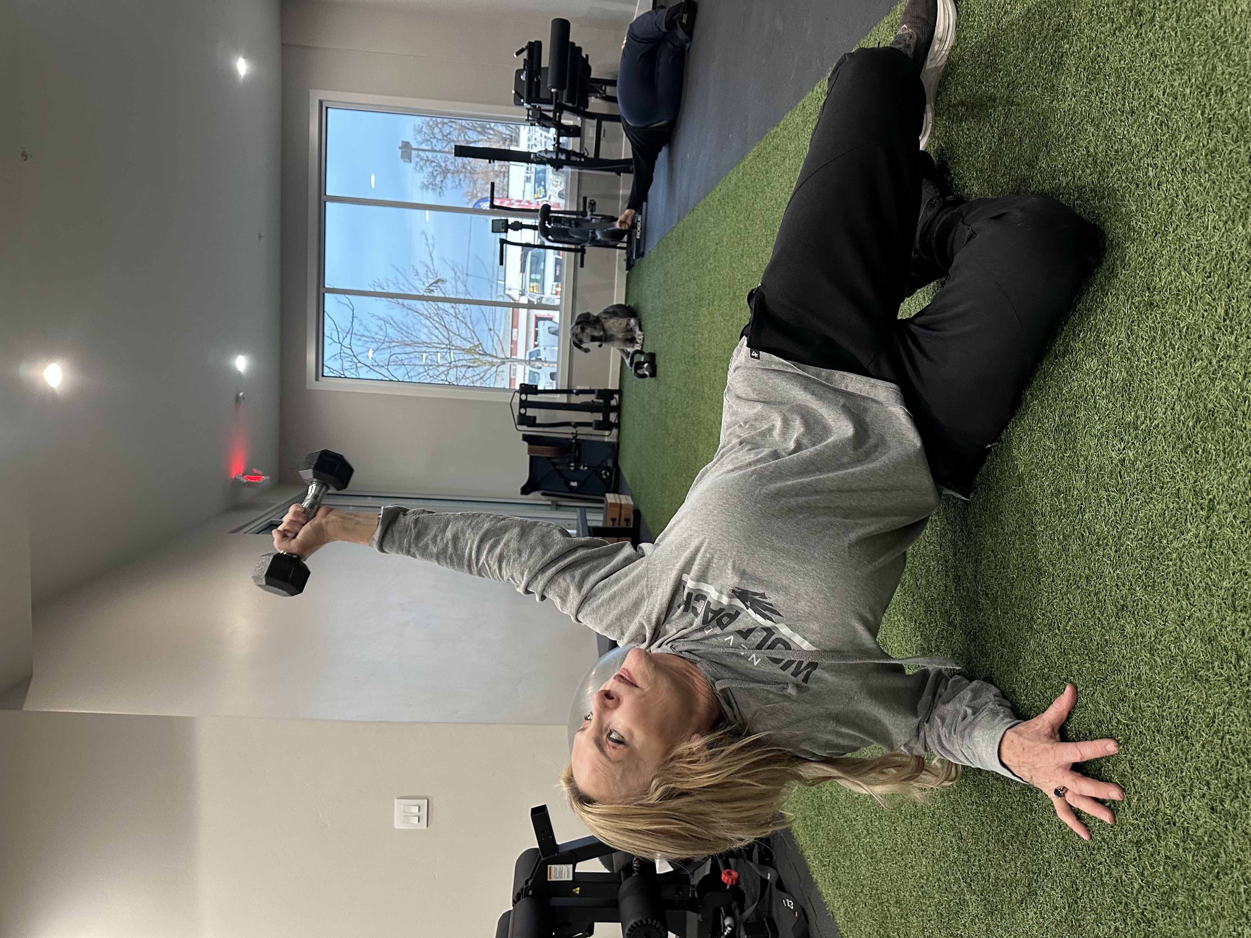 Patient Nanette performing shoulder rehabilitation at MVMT Rx in Reno, NV