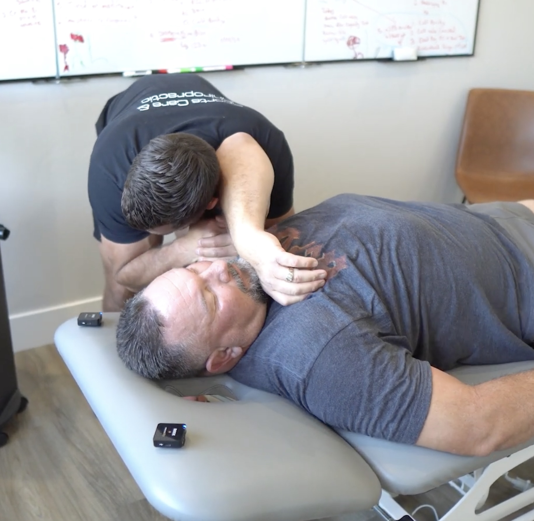Dr. Kyle performing a shoulder chiropractic adjustment on a patient at MVMT Rx in Reno, NV