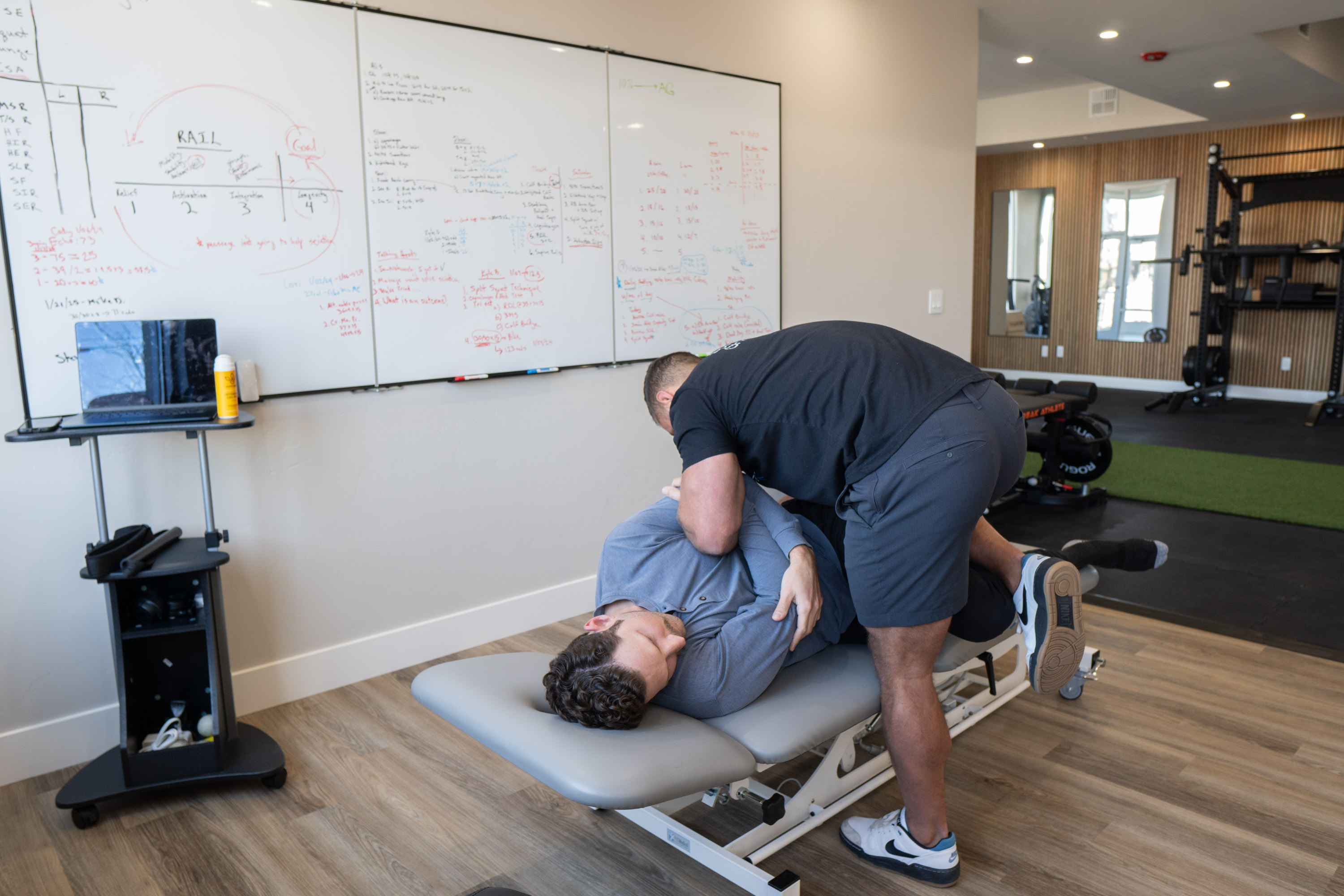 Dr. Kyle performing a chiropractic low back adjustment at MVMT Rx Sports Care and Chiropractic in Reno NV