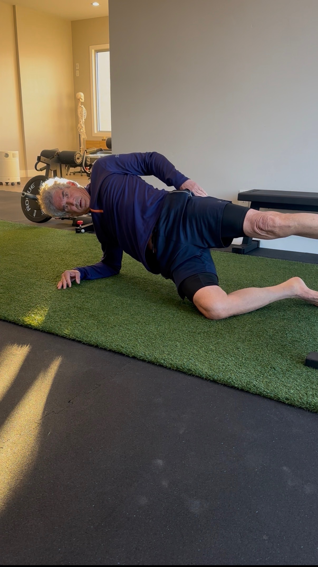 Glenn Carano, ex-NFL quarterback, performing a Copenhagen plank for hip stability training at MVMT Rx in Sparks NV