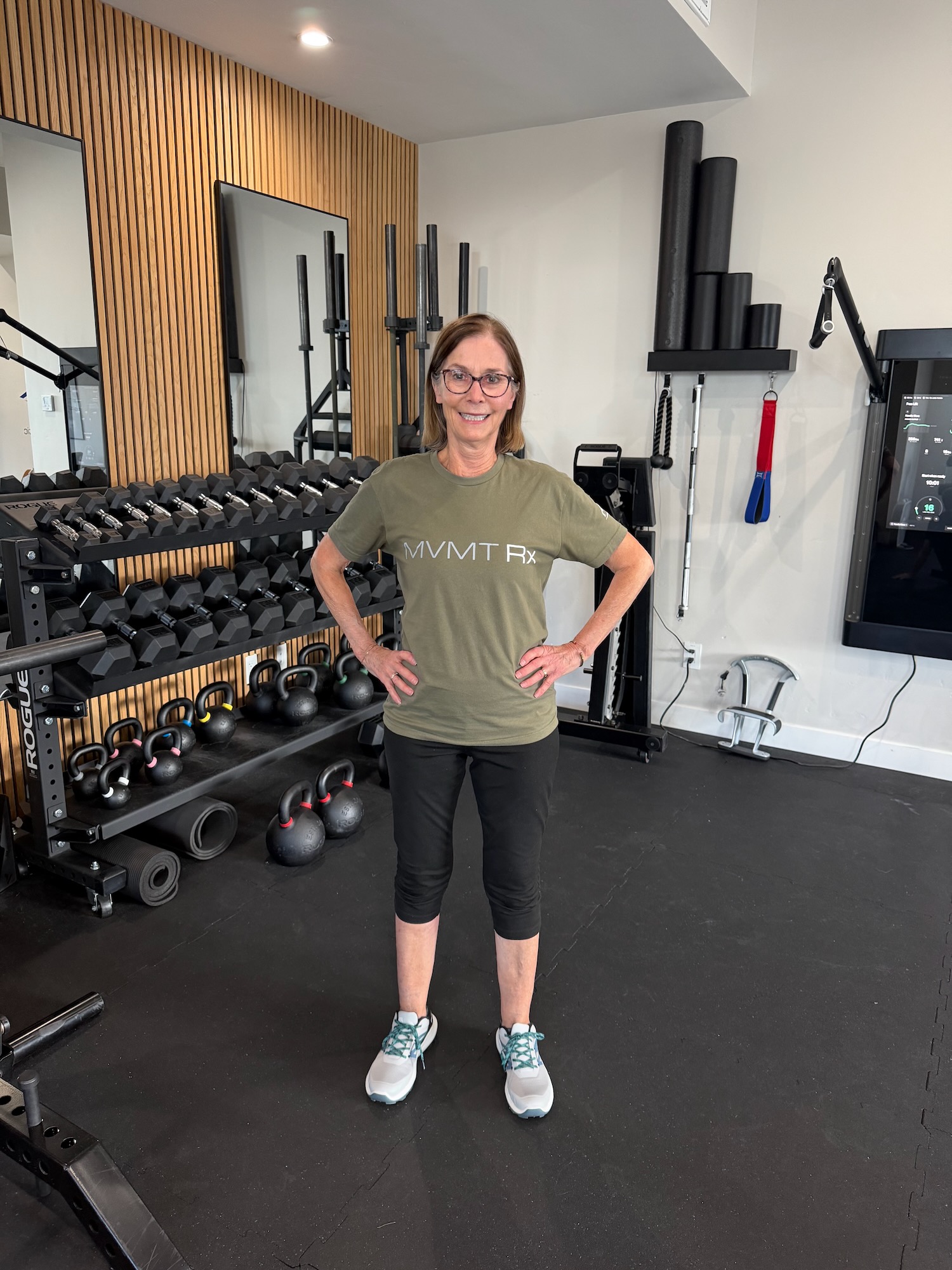 Standing with weight evenly distributed and feet hip-width apart to offload the gluteal tendon — MVMT Rx Reno Sparks NV