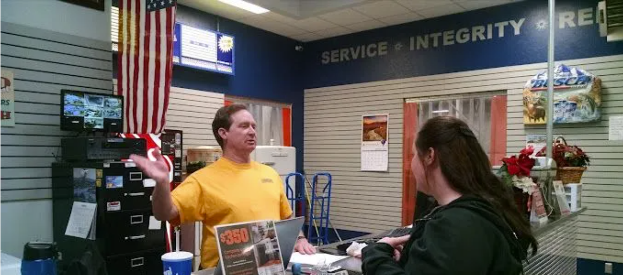Appliance Exchange of Utah team member helping a customer at the Orem store