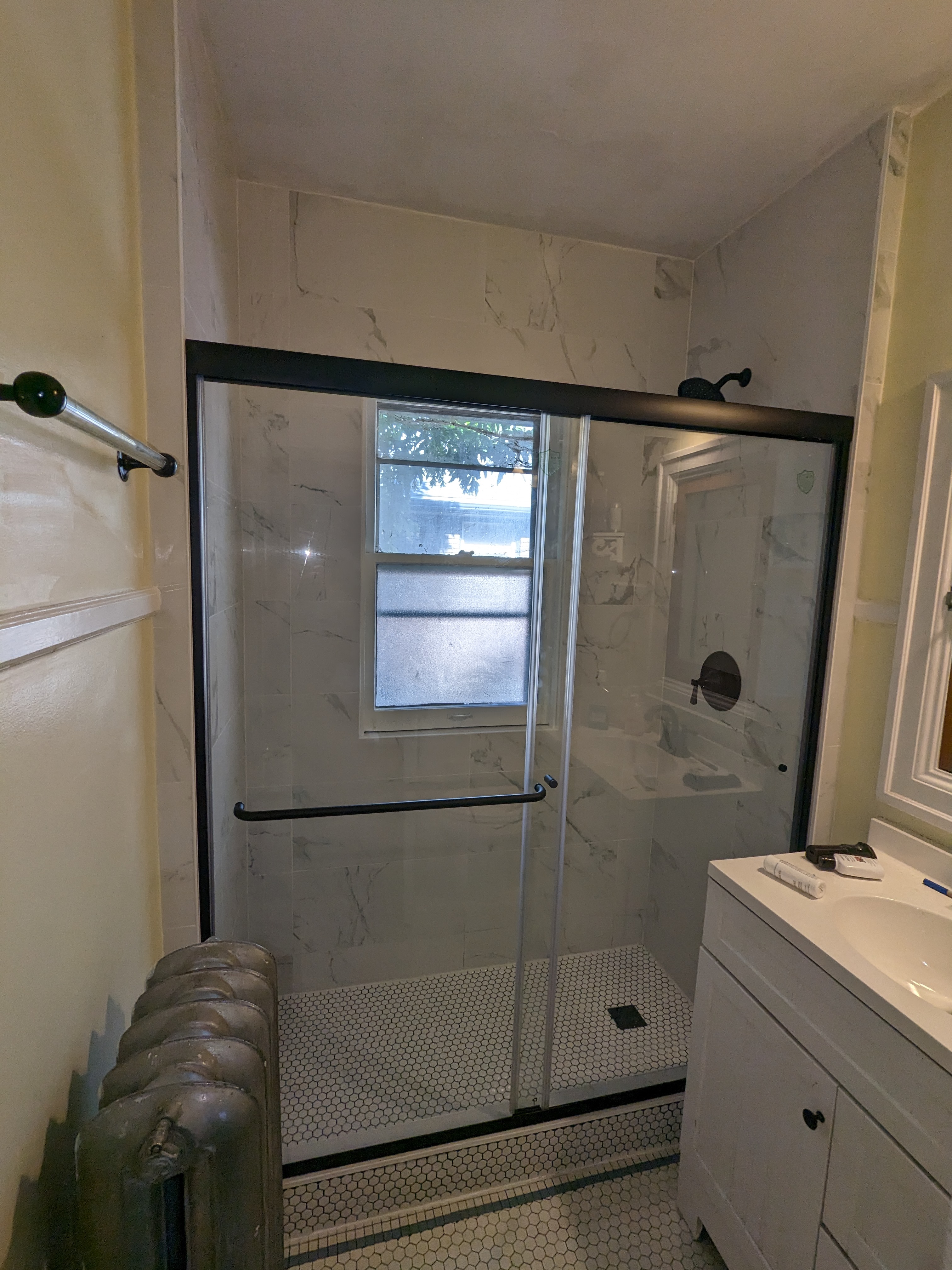 Bathroom remodel after work with tiled shower