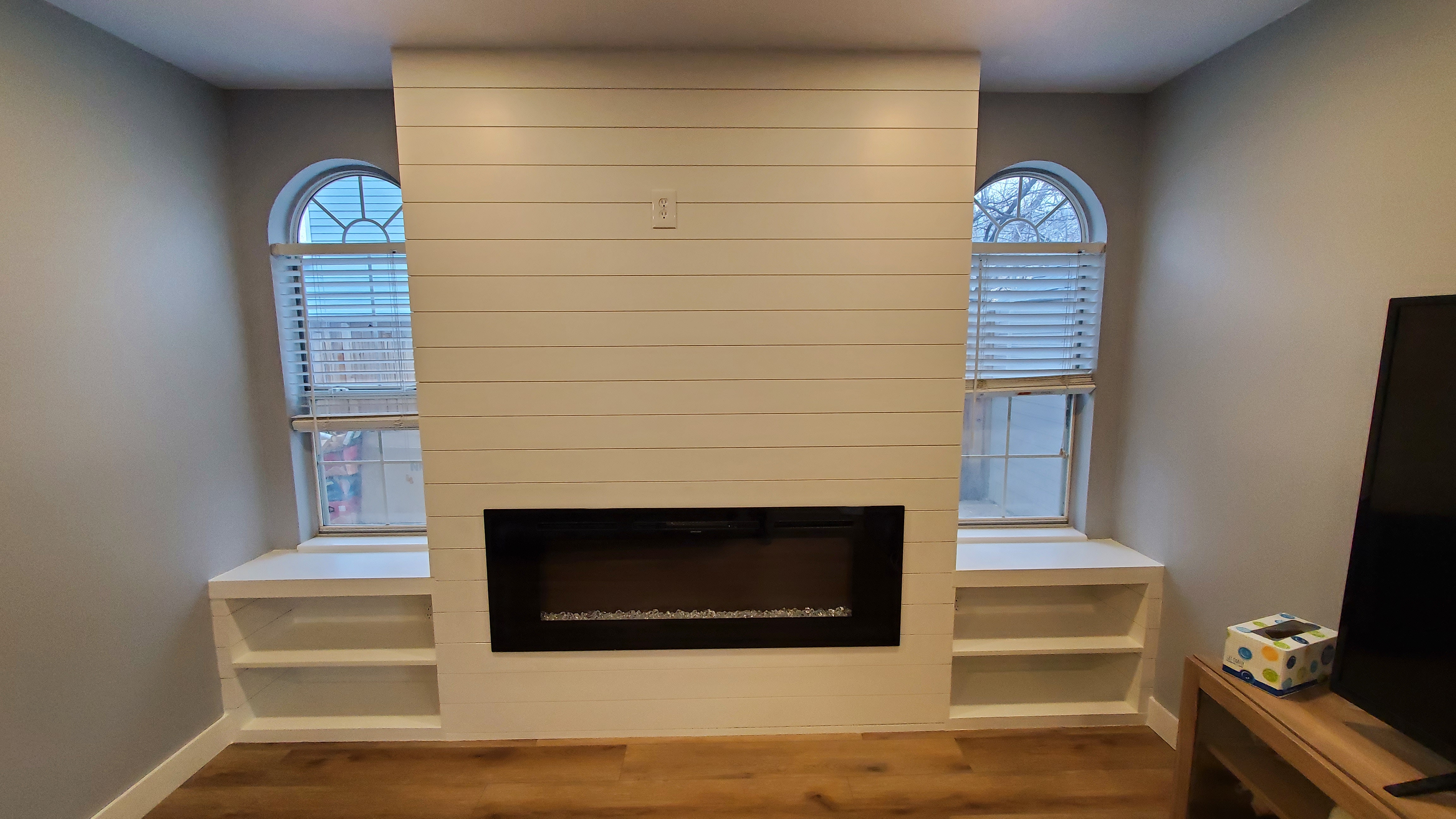 Finished fireplace with built-in shelving