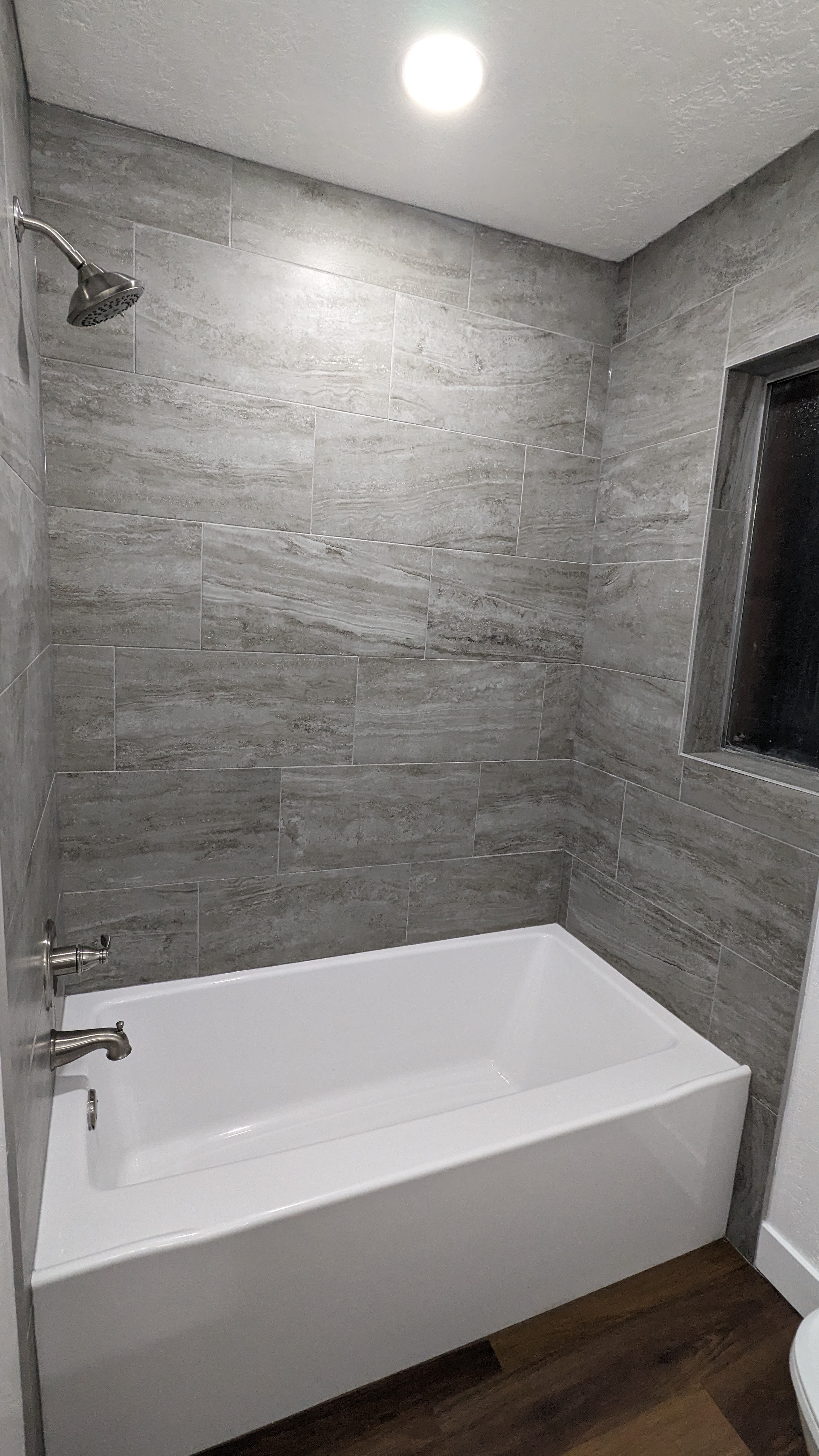 Finished bathtub and tile surround by Maxx Construct