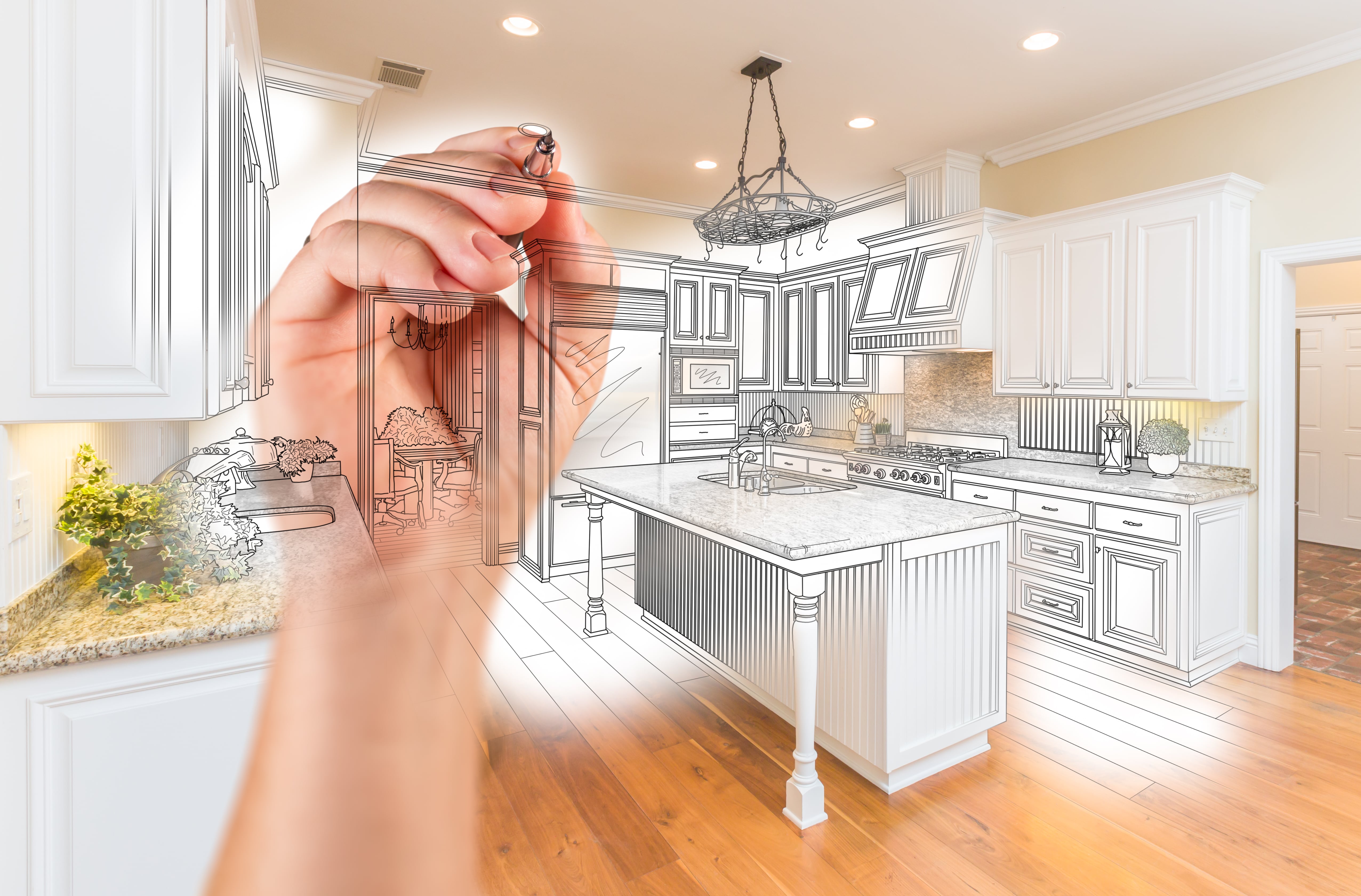 a hand drawing a kitchen