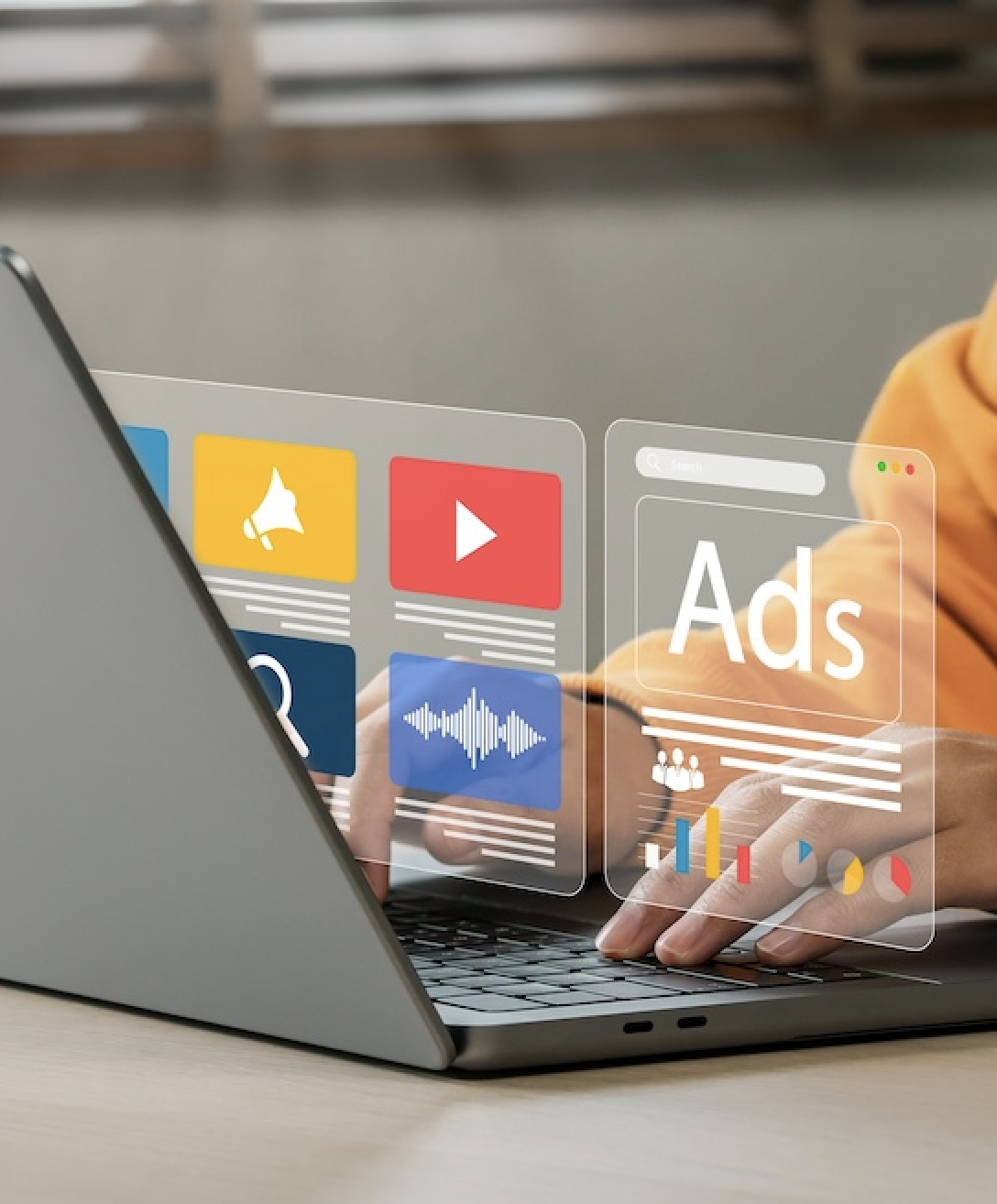 Person using laptop with digital marketing tools and ads interface, illustrating marketing and social media services for business enhancement.