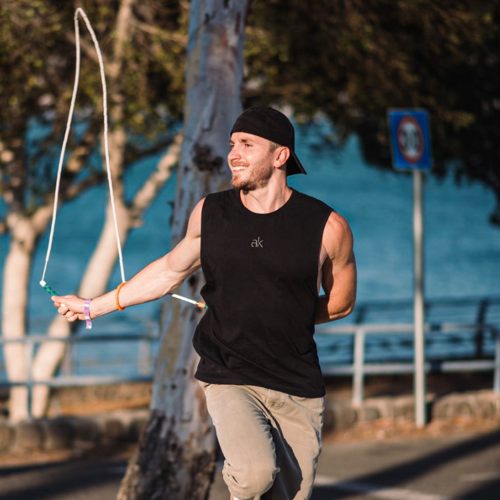 Michael jumping rope outdoors by the sea