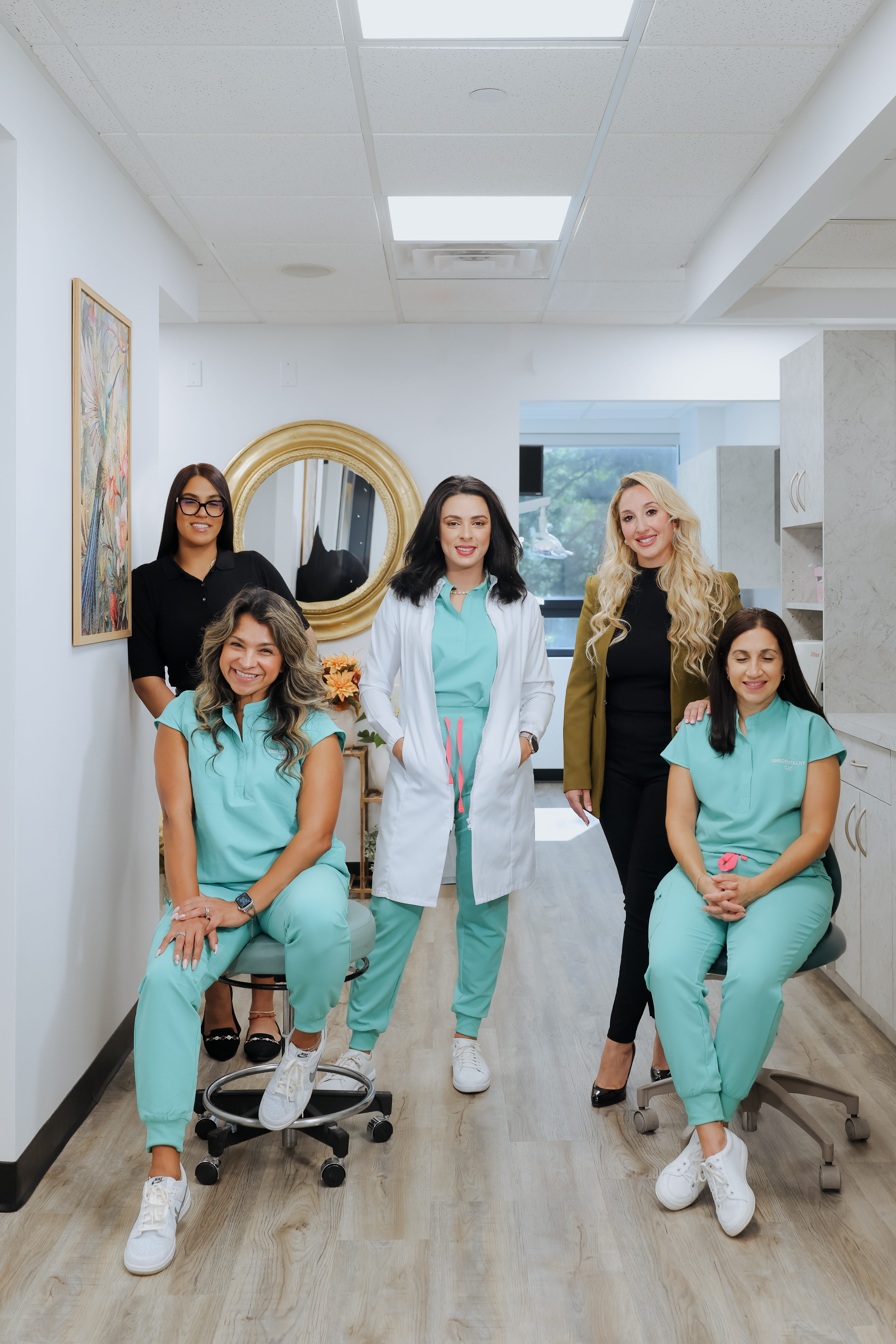 Group of dental team members smiling together representing friendly staff and welcoming clinic environment for patients