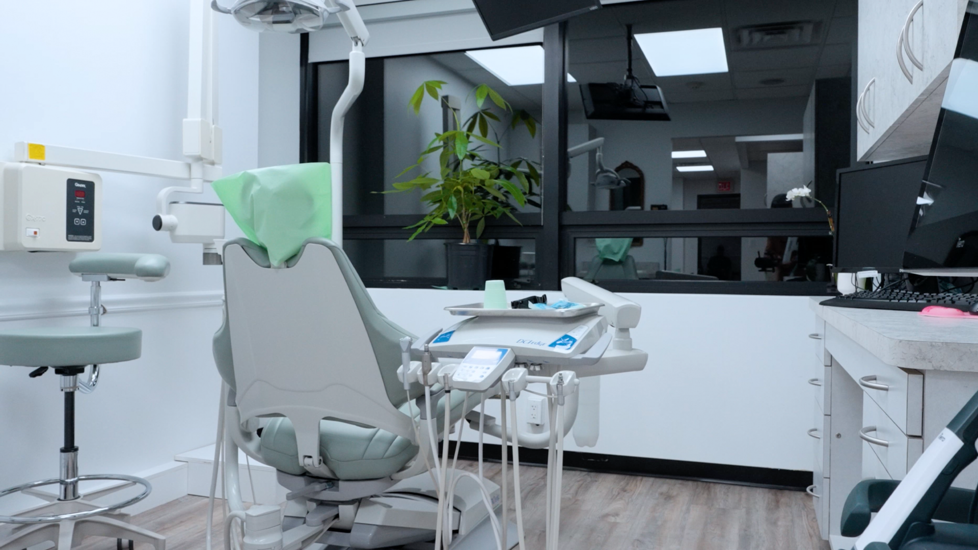 A patient and a dentist smiling together, representing successful treatment outcome and positive dental care experience