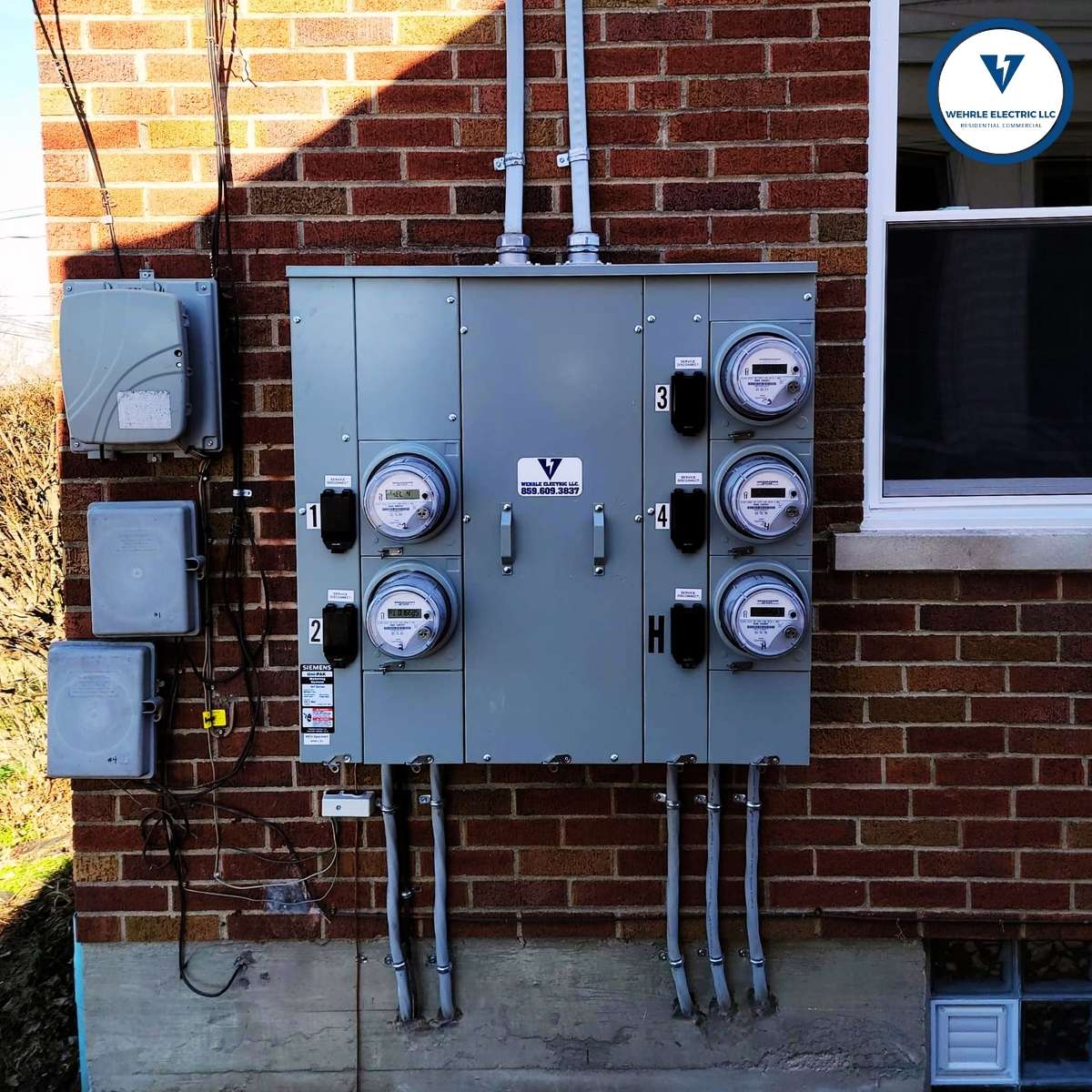 Image of a4-gang meter upgrade for a multi-unit building in Villa Hills, KY. Trusted, Local and Licensed Electricians. Wehrle Electric 