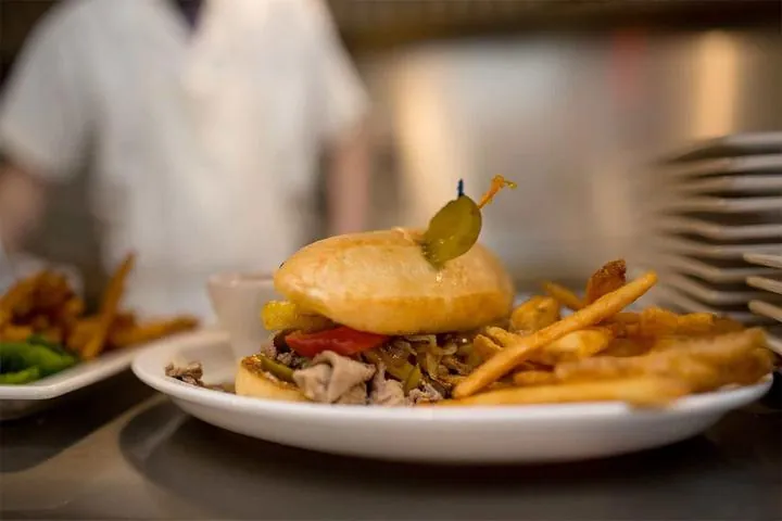 Stacked cheeseburger with fries at Mrs. Riches