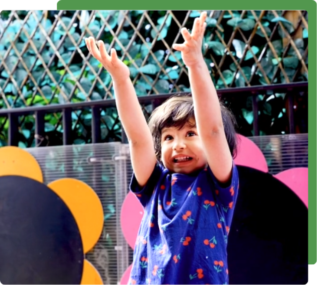 happy child playing outside at nursery