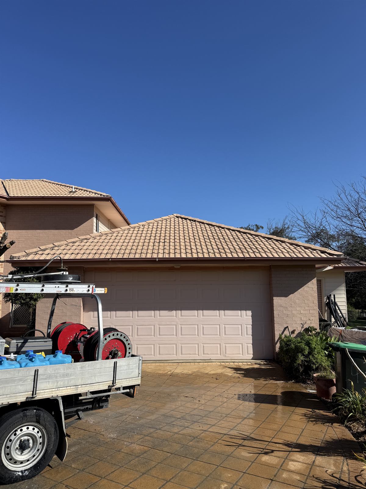 Tile roof after cleaning, front view, at a Shellharbour property showing a visibly cleaner surface