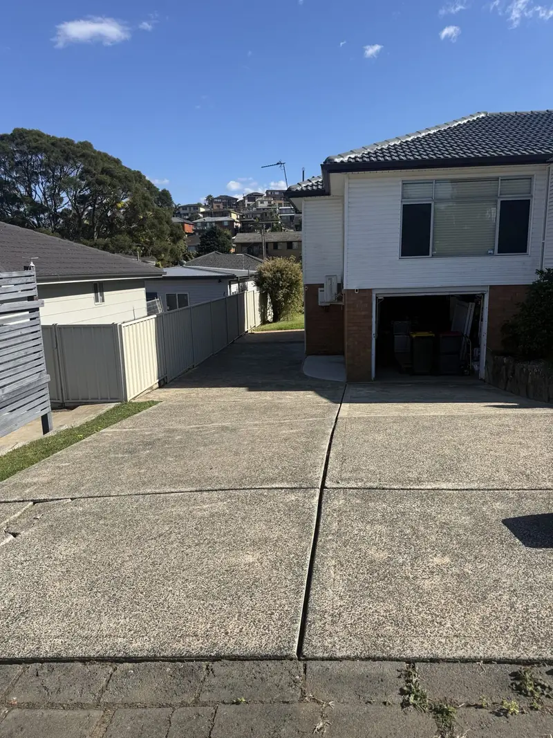 Faded exposed aggregate driveway before cleaning and colour sealing