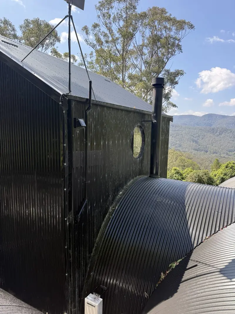 Black corrugated walls before cleaning in Jamberoo