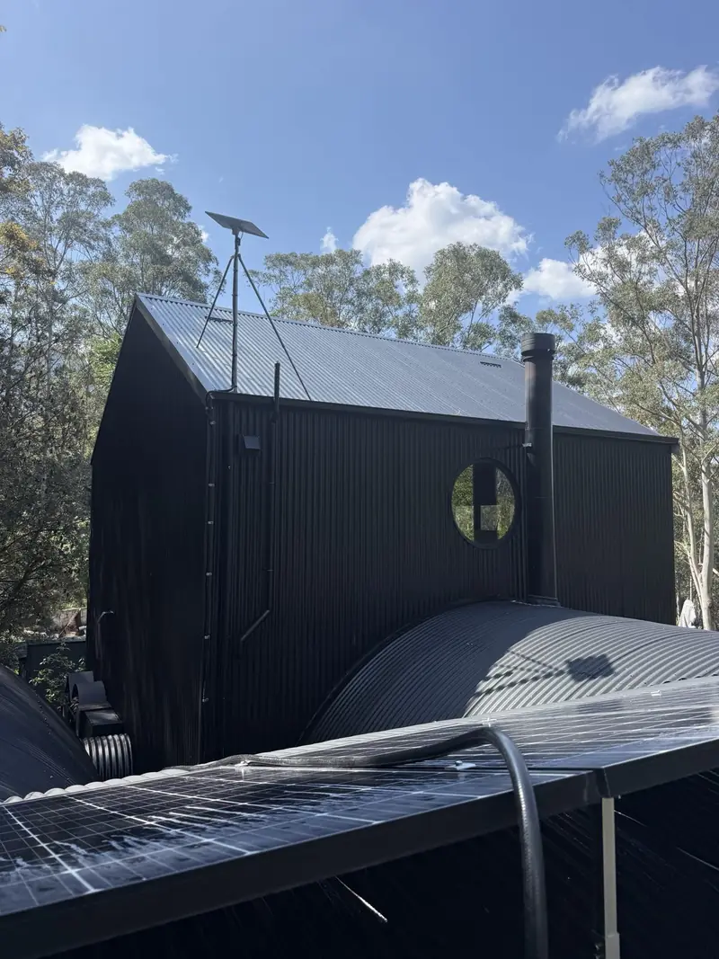 Black corrugated walls and curved roof after cleaning in Jamberoo, second view
