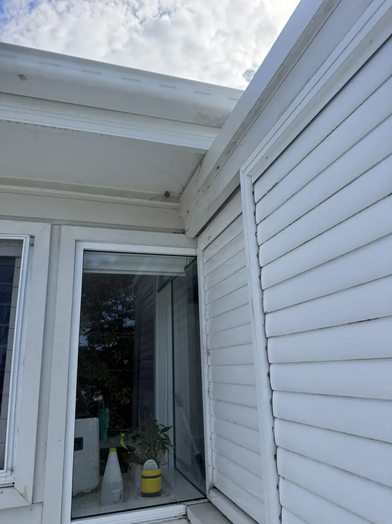 Eaves and window frames before washing in Thirroul