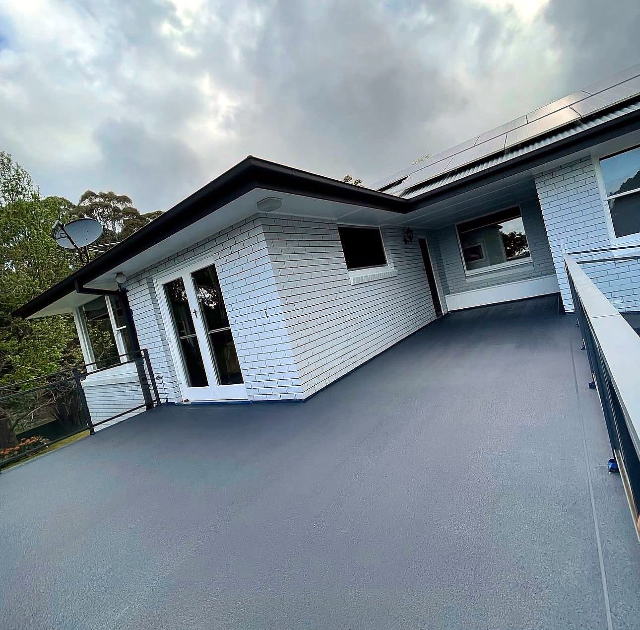 Same balcony with a fresh charcoal floor coating