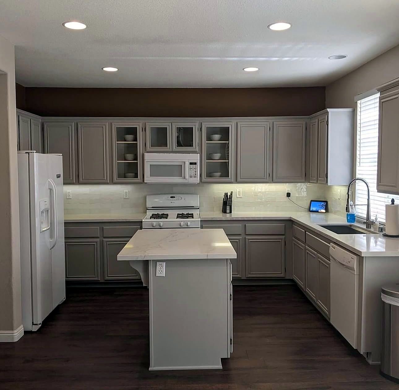 Same kitchen with cabinets painted soft grey