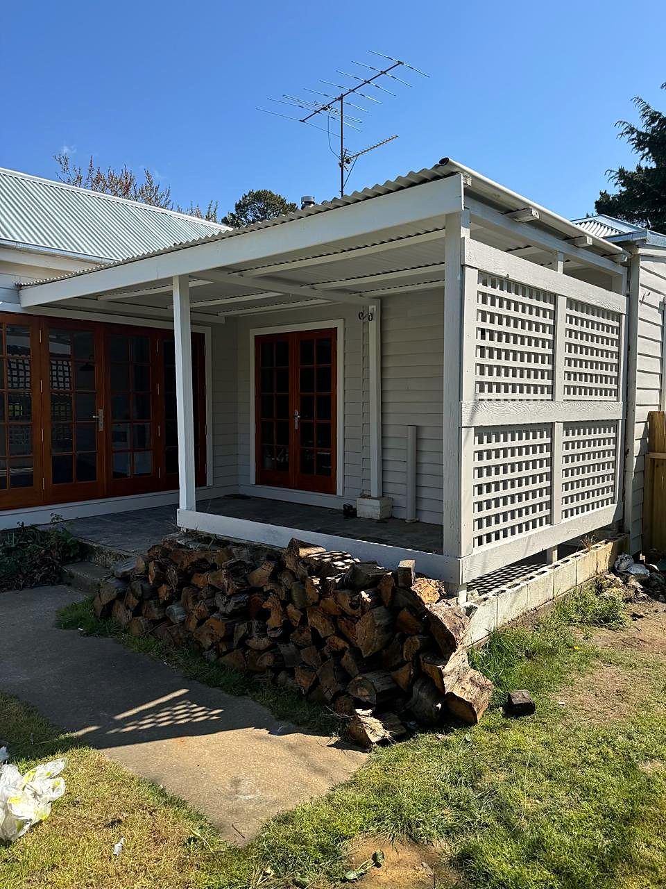 Rear of a weatherboard cottage after repainting