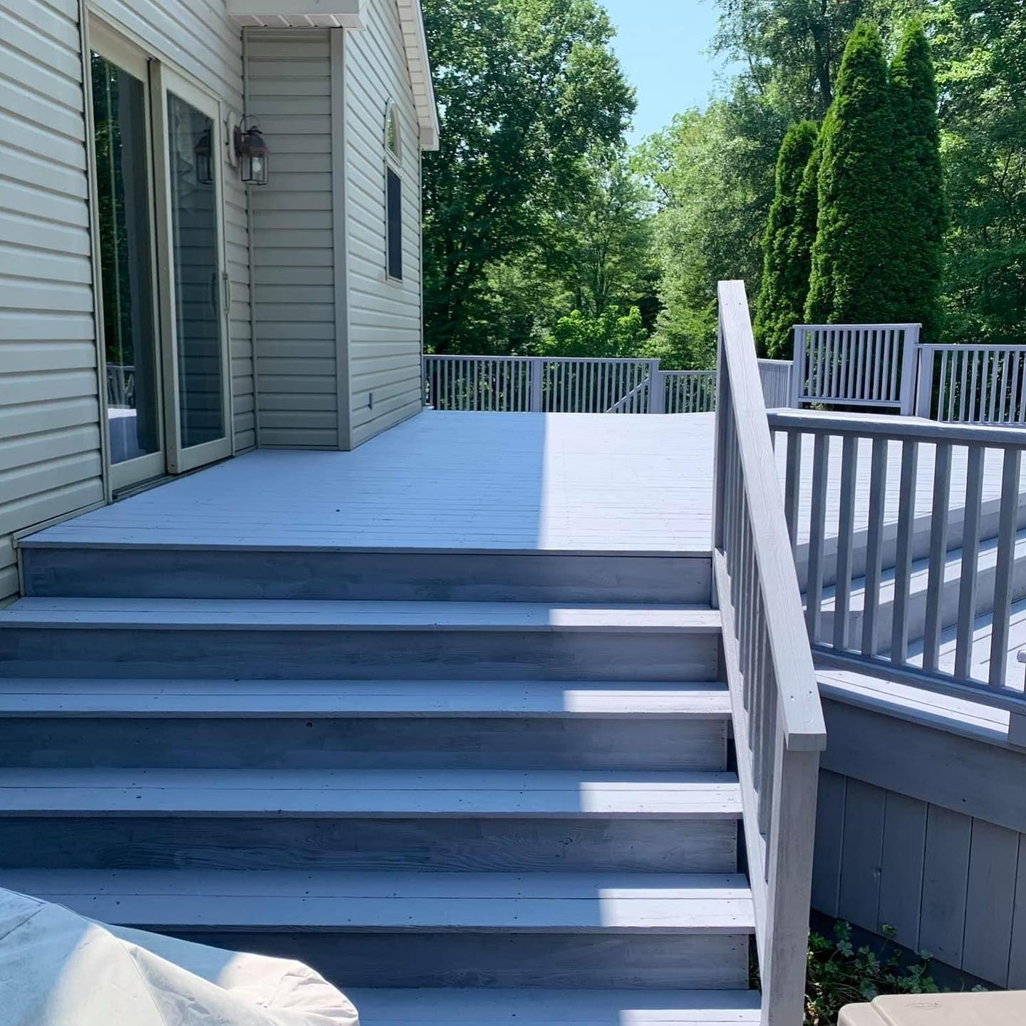Deck stairs and balustrade painted grey and white