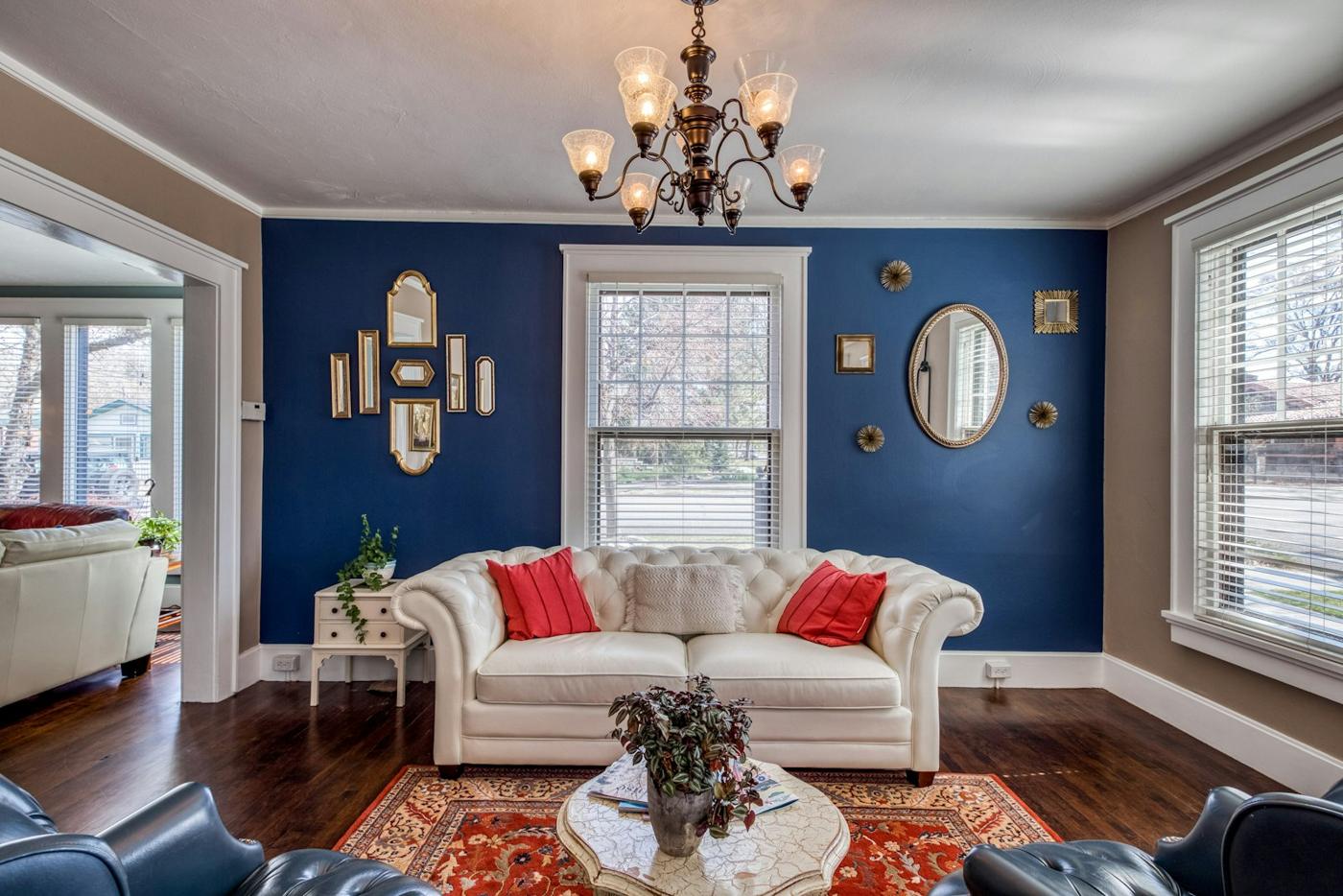 Living room with a deep navy feature wall