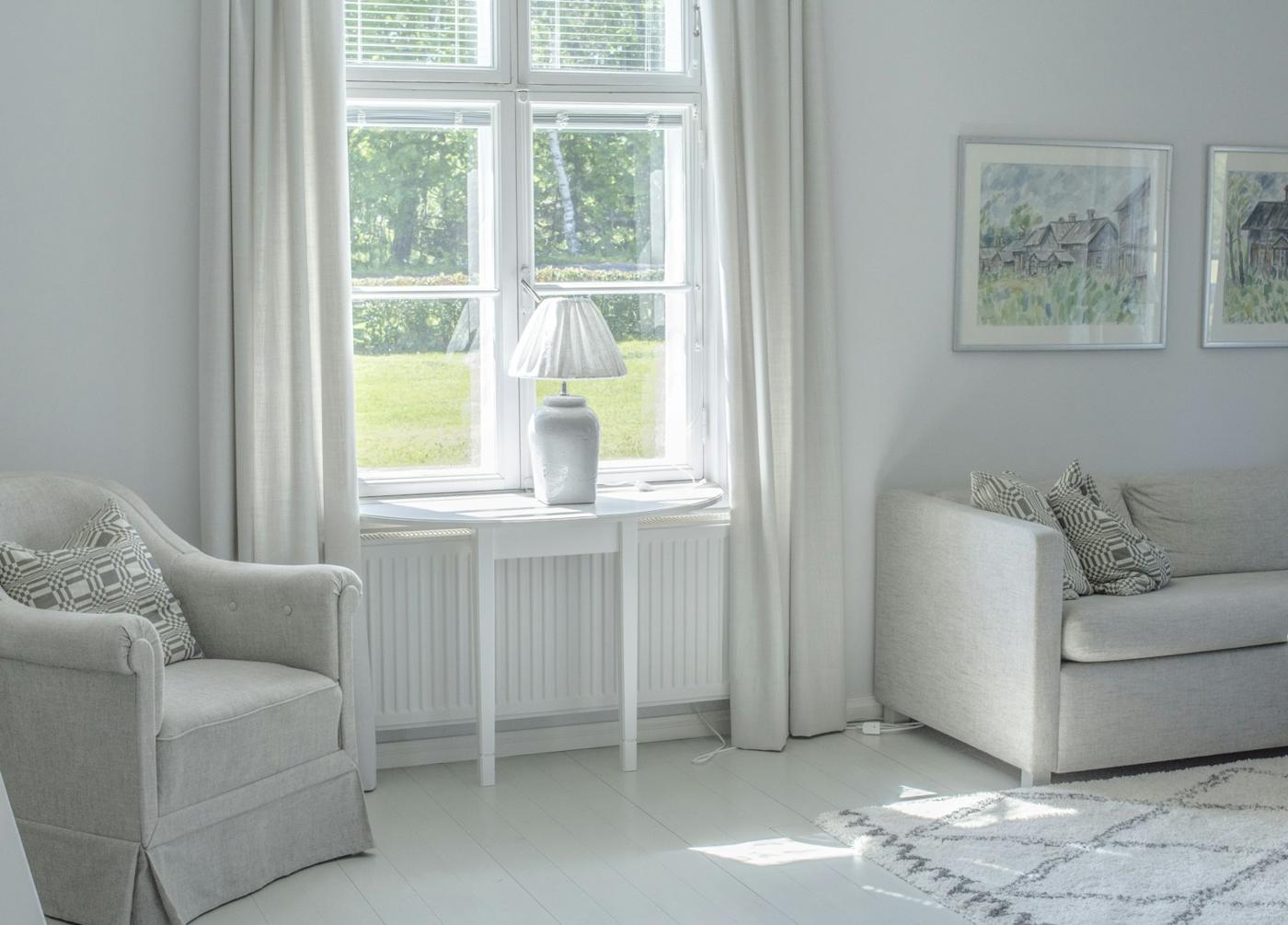 Sunroom with crisp white walls and trims