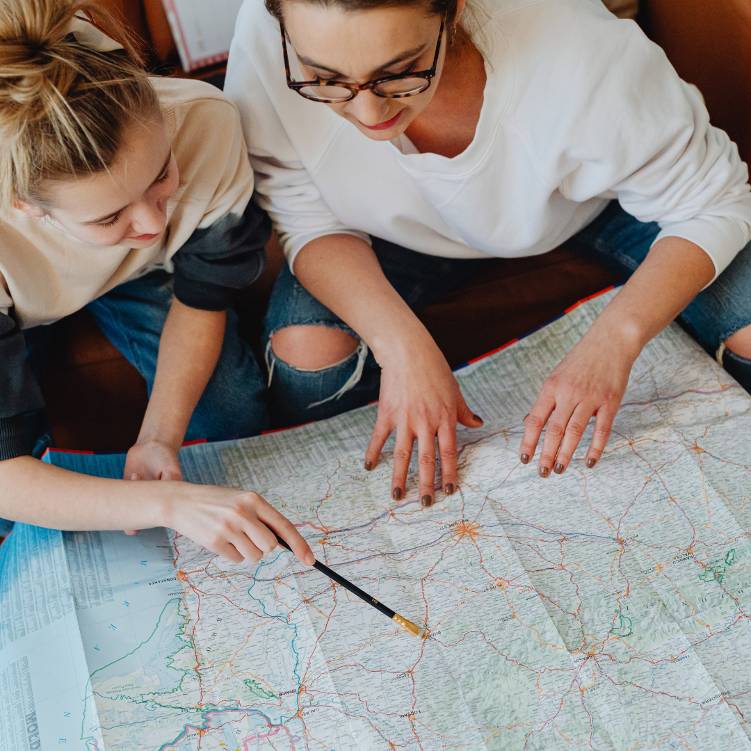 Woman looking at a map during a life transition and period of personal change