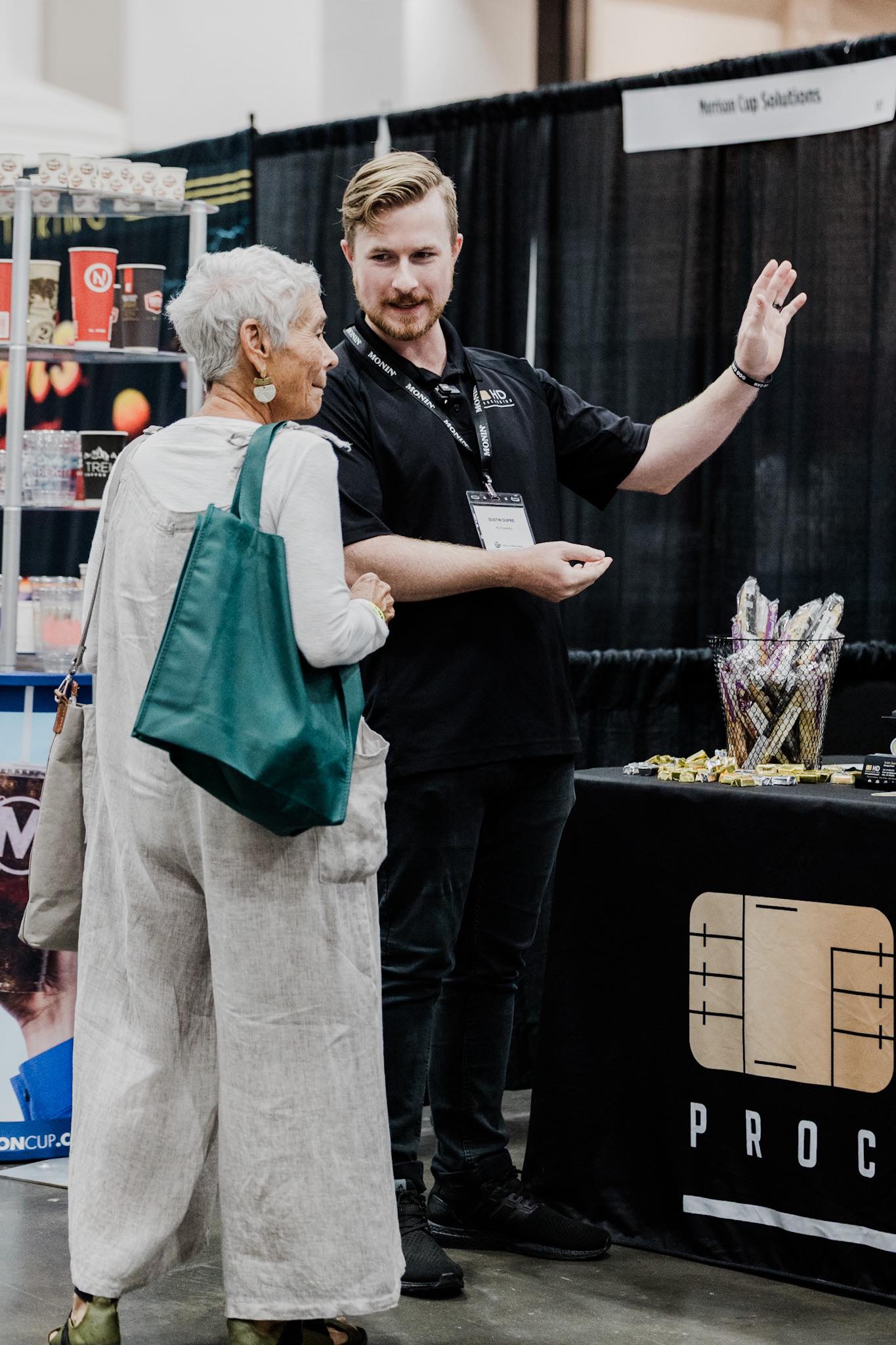 HD Processing team member with a Lafayette business owner at a trade show