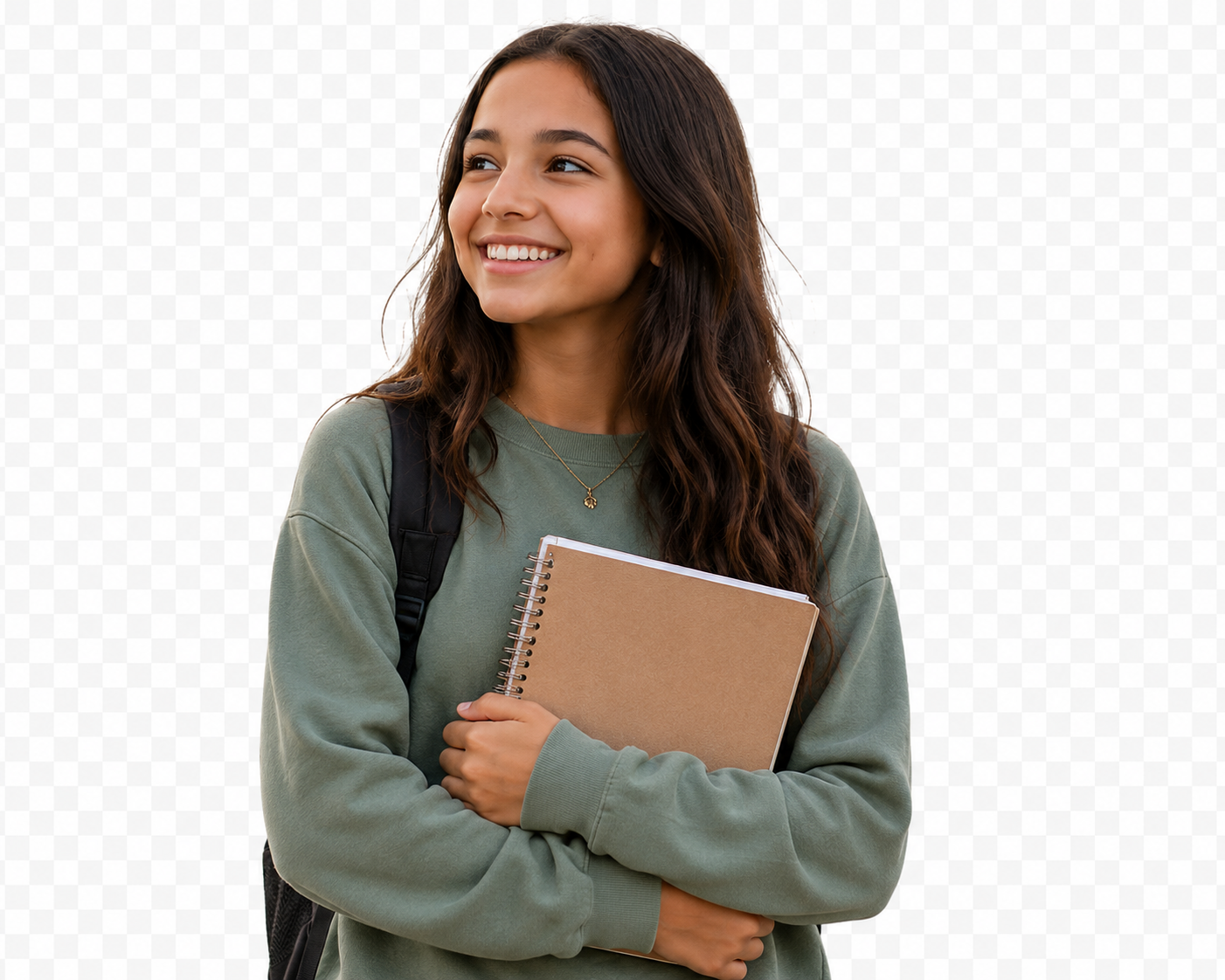 Teen girl in a green sweater smiling and holding a notebook