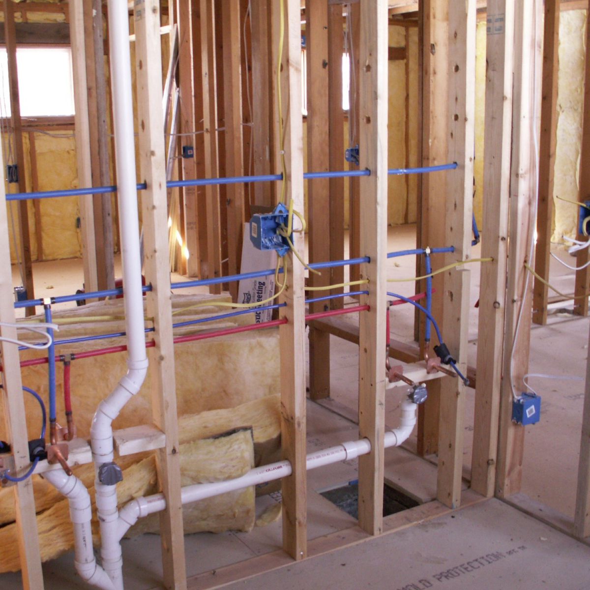 Licensed residential plumber working on pipes in Phoenix