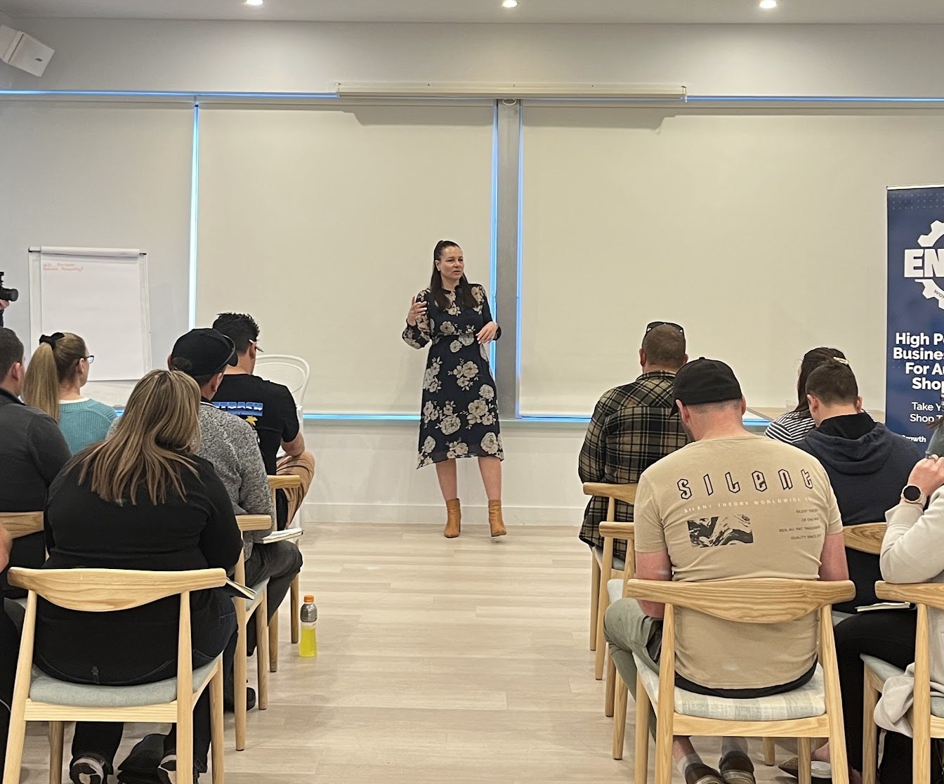 Rachael Evans presenting to a room of auto repair shop owners