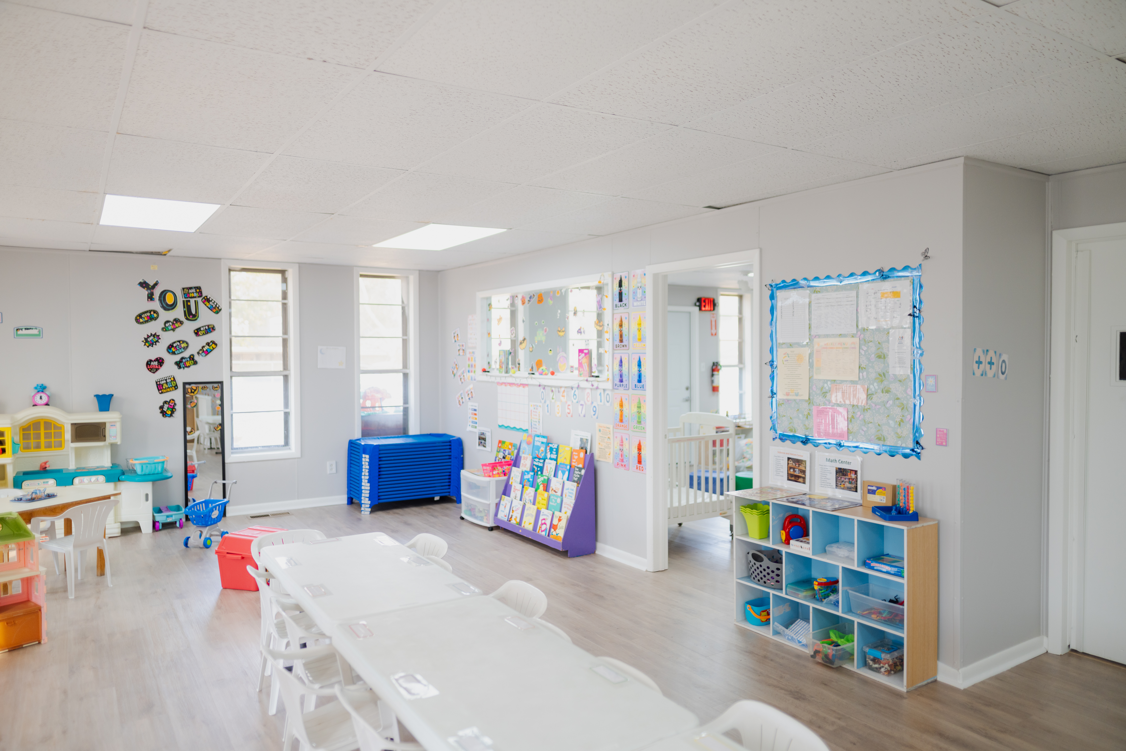 Bright Start Learning Center teacher warmly interacting with children in a welcoming Oklahoma City classroom