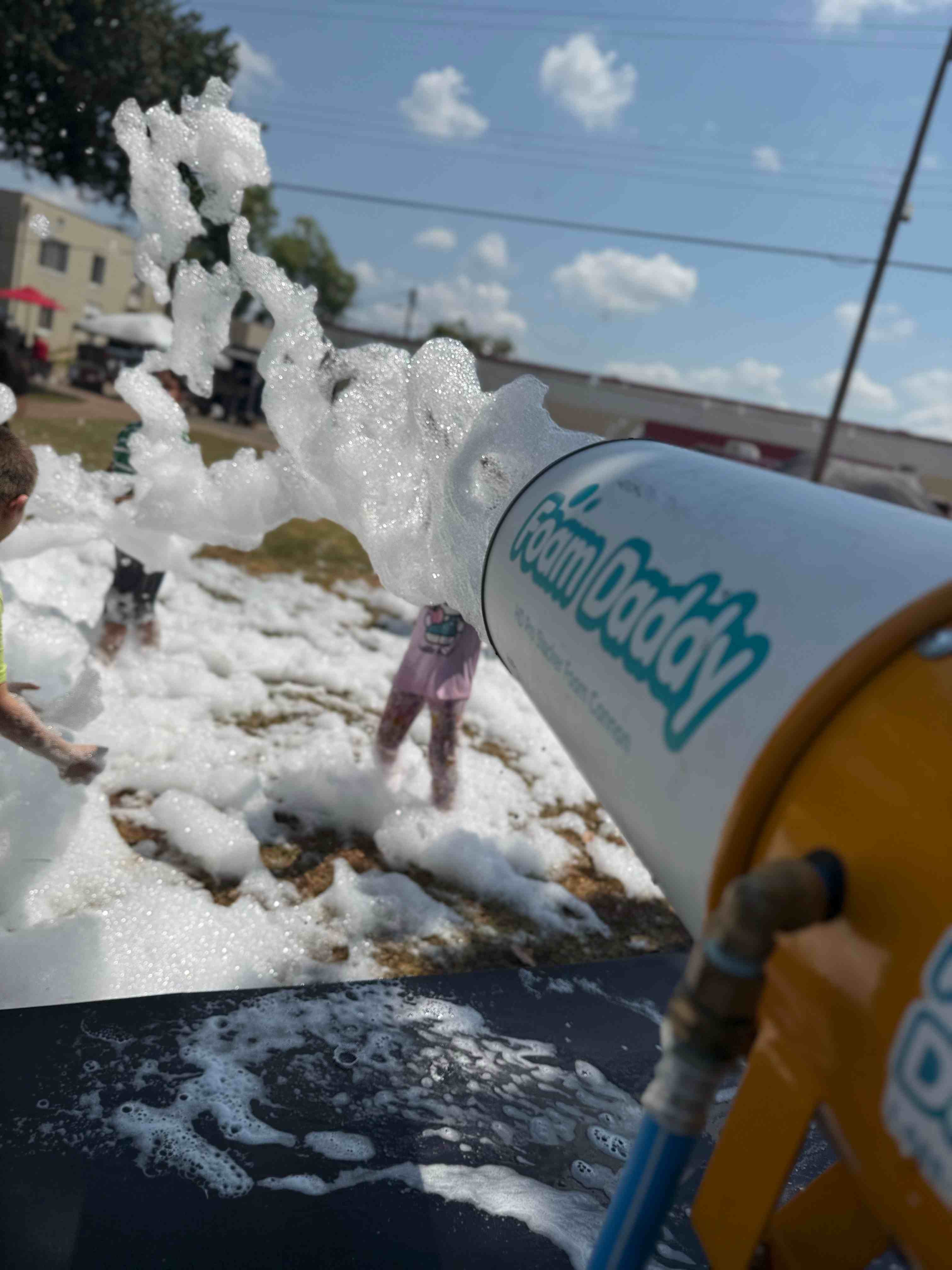 Backyard foam party rental in action