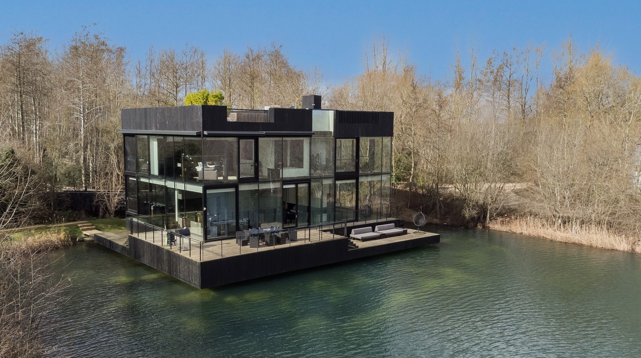 The Glass House by the Lake, viewed across Huntsman Lake at The Lakes by Yoo, Cotswolds