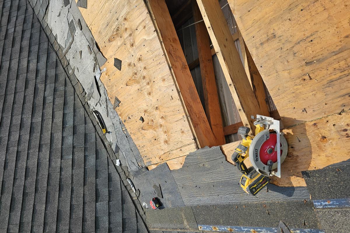 Rotted roof decking cut out and replaced before new shingles are installed