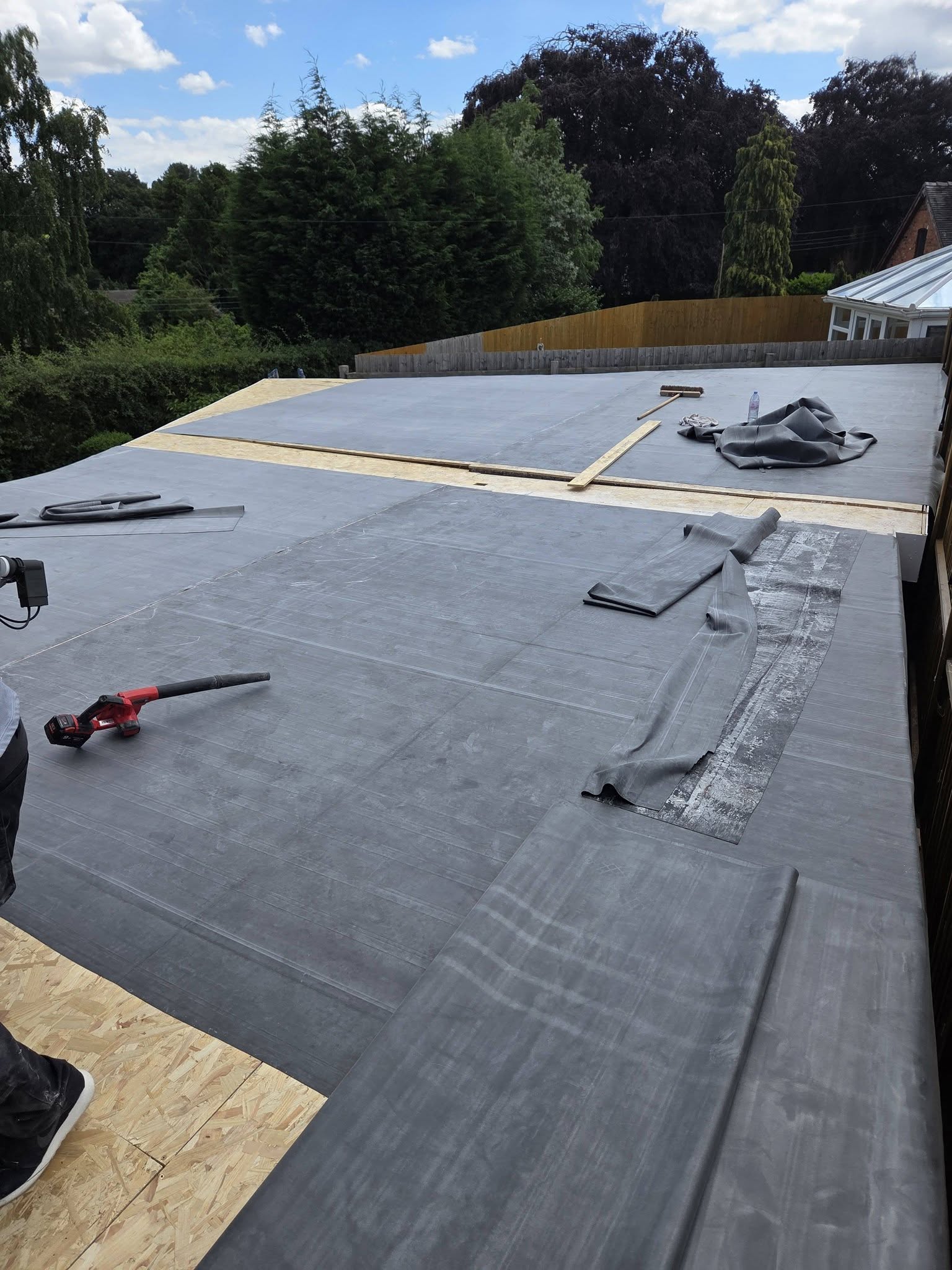 New EPDM rubber flat roof being installed
