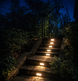 Recessed lights illuminating garden steps at night