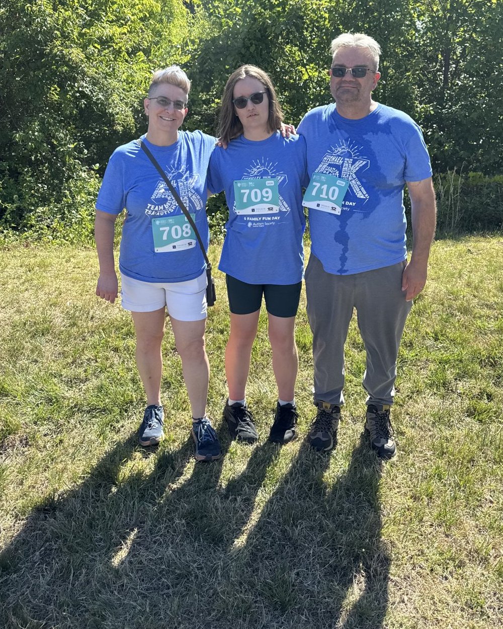 Graham, his wife and his daughter in race bibs at the charity 5K