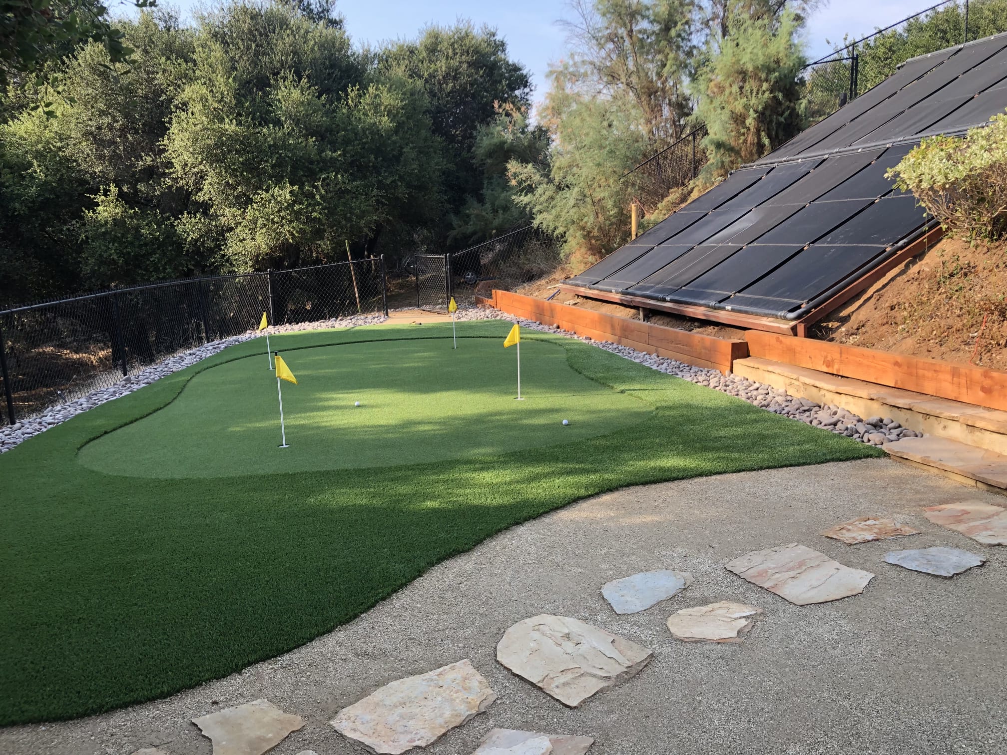 Compact backyard putting green with multiple holes