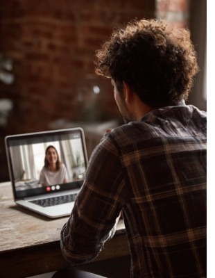 Person attending an online counselling session from home on a laptop, illustrating how secure online counselling sessions work in South Africa.