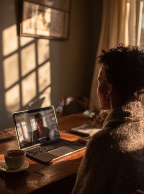 Person attending a secure online counselling session from home on a laptop, showing how online counselling sessions work in South Africa in a calm, private setting.