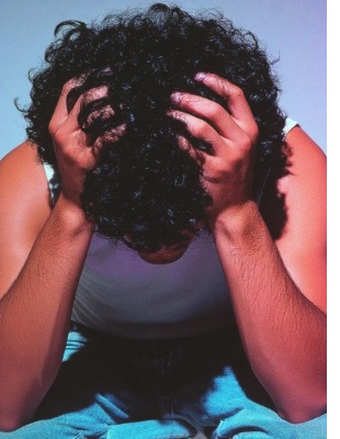Person holding their head in distress, symbolising inner anger, frustration, and emotional overwhelm that counselling can help address. Person holding their head in distress, symbolising inner anger, frustration, and emotional overwhelm that counselling can help address.
