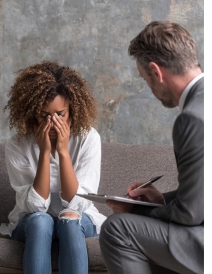 Woman feeling overwhelmed during a counselling session, illustrating the emotional impact of anger, distress, and the need for compassionate support. Woman feeling overwhelmed during a counselling session, illustrating the emotional impact of anger, distress, and the need for compassionate support.