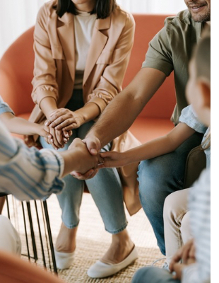 Family members joining hands during a counselling session focused on connection, support and communication Family members joining hands during a counselling session focused on connection, support and communication