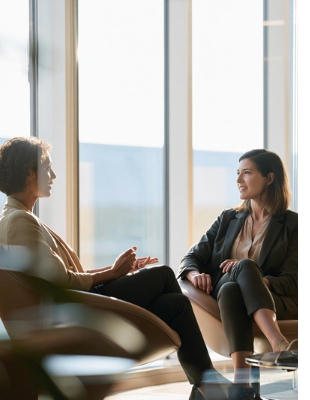 Two women talking during an individual counselling session in a calm private setting Two women talking during an individual counselling session in a calm private setting