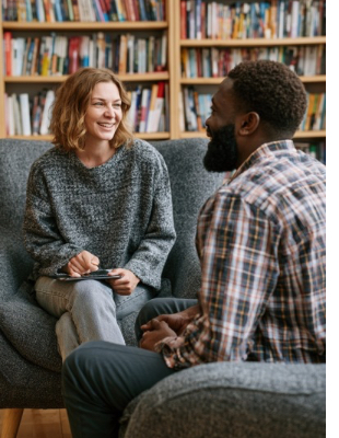 Counsellor and client talking in a comfortable counselling room, representing a supportive counselling relationship Counsellor and client talking in a comfortable counselling room, representing a supportive counselling relationship