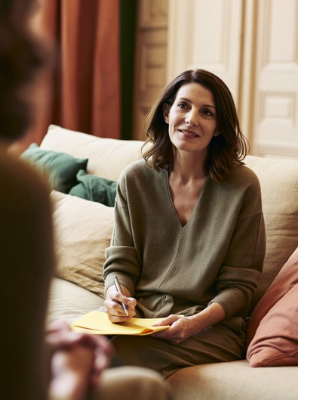     Woman speaking with a counsellor about persistent low mood, depression symptoms and emotional wellbeing
