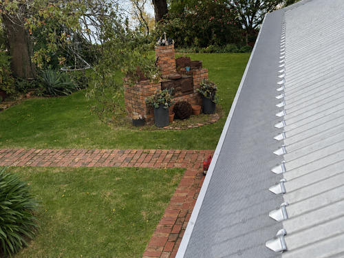 Corrugated gutter guard — mountain valley view